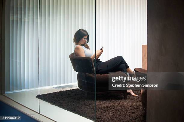 businesswoman on phone in architectural office - window blind stock pictures, royalty-free photos & images