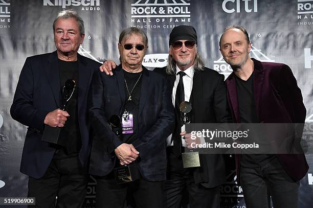 Ian Gillan, Ian Paice, and Roger Glover of Deep Purple pose with Lars Ulrich of Metallica on stage in the press room at the 31st Annual Rock And Roll...