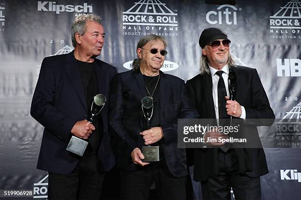 Ian Gillan, Ian Paice, and Roger Glover of Deep Purple pose on stage in the press room at the 31st Annual Rock And Roll Hall Of Fame Induction...