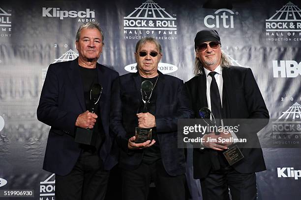 Ian Gillan, Ian Paice, and Roger Glover of Deep Purple pose on stage in the press room at the 31st Annual Rock And Roll Hall Of Fame Induction...