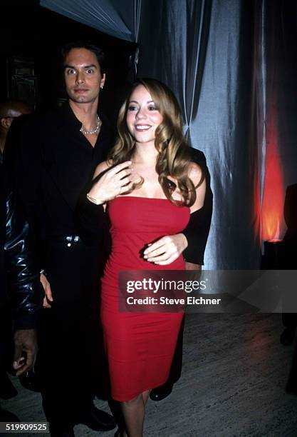 Marcus Schenkenberg and Mariah Carey at Sean 'Puffy' Combs' birthday party, New York, November 4, 1998.