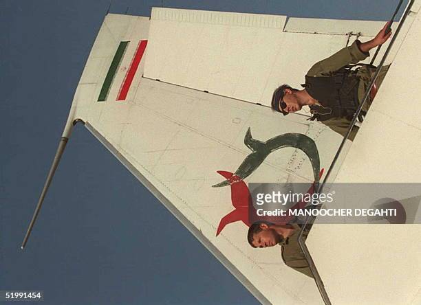 Israeli soldiers stand on a gangway of the Iranian Kish Airlines plane after commandos boarded the plane at Ovda military airport in the Negev desert...