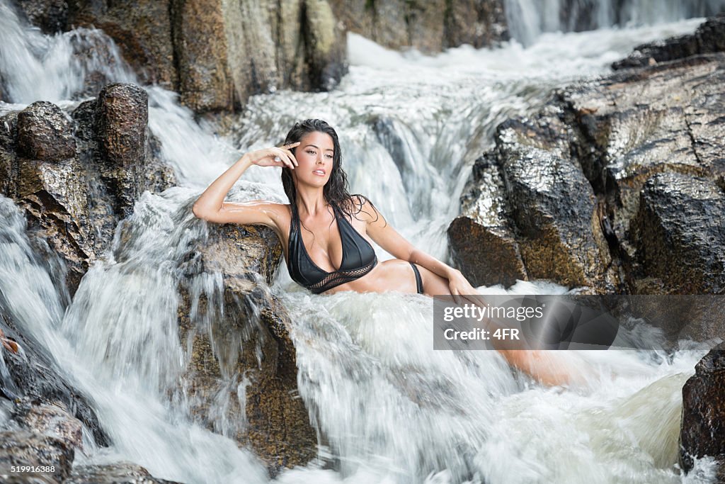 Woman relaxing in a natural Mountain Stream Spa