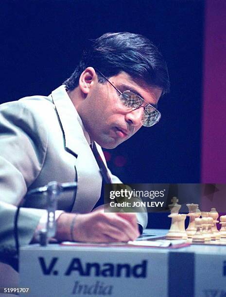 World Chess challenger Vichy Anand of India writes down his move in the first match of the World Chess Championship against champion Gary Kasparov...