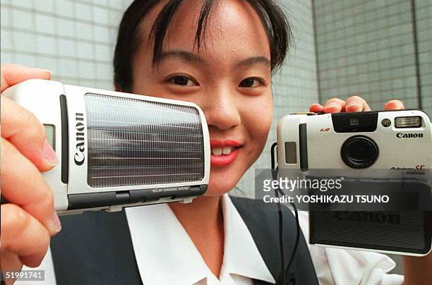 Japan's Canon Inc. Unveils the world's first solar-powered camera, Autoboy SE 08 September in Tokyo. Solar battery cells are mounted on its front...