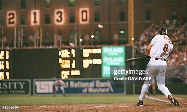 Cal Ripken, Jr., of the Baltimore Orioles hits a home run in the sixth inning of Baltimore's 05 September game against the California Angels at...