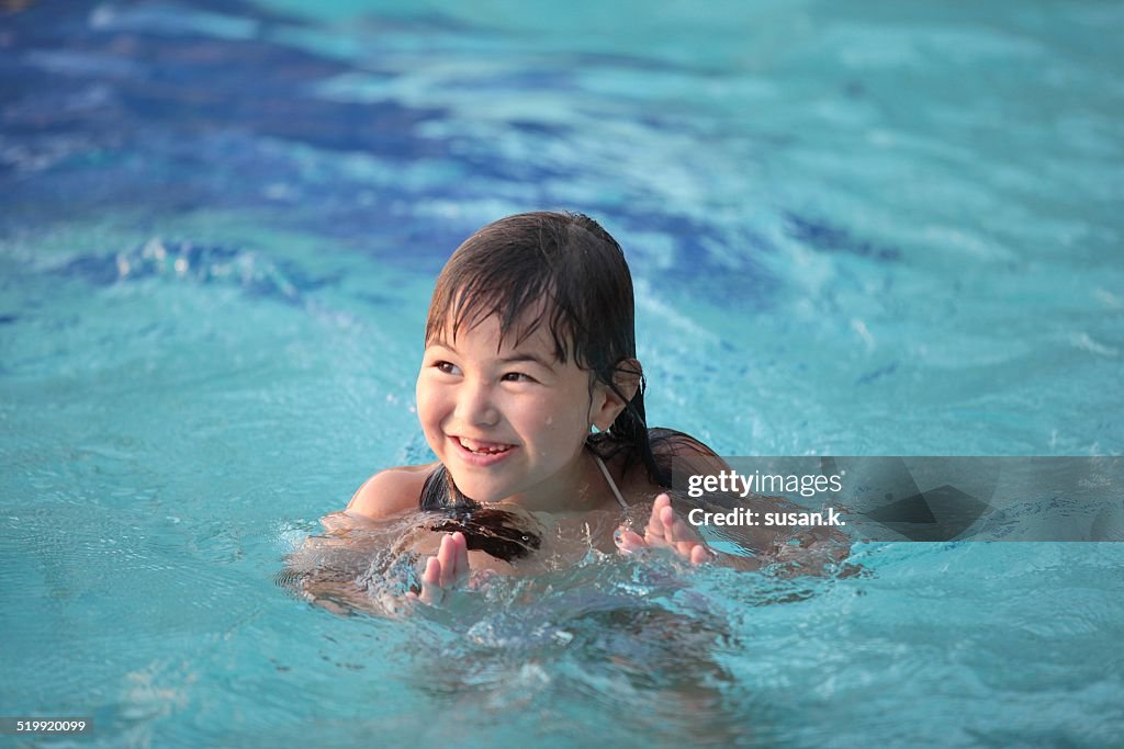 Young girl enjoys her afternoon swim