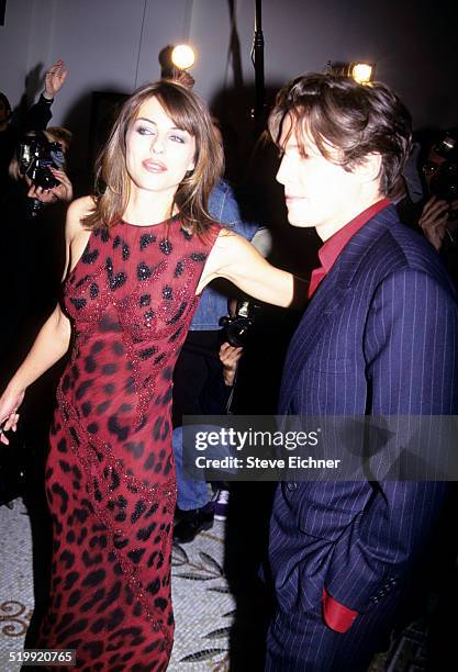 Elizabeth Hurley and Hugh Grant at opening party for Versace store, New York, October 26, 1996.