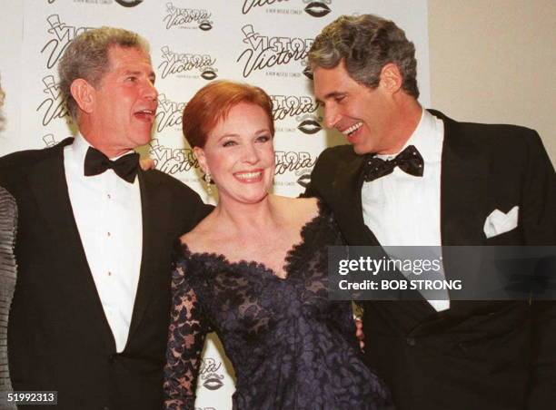 Actress Julie Andrews is joined by cast members Tony Roberts and Michael Nouri following the opening of the musical "Victor/Victoria 26 October in...