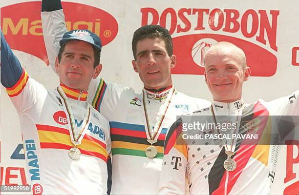 Miguel Indurain of Spain,winner of the World Cycling Championships individual time-trial competition stands 04 October on the podium with compatriot...