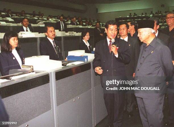 Indonesian President Suharto tours the Jakarta Stock Exchange during an inauguration ceremony 03 October. Suharto officially opened the Jakarta...