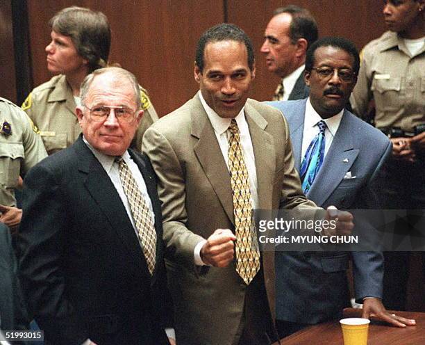 Murder defendant O.J. Simpson listens to the not guilty verdict with his attorneys F. Lee Bailey and Johnnie Cochran Jr . Simpson was found not...