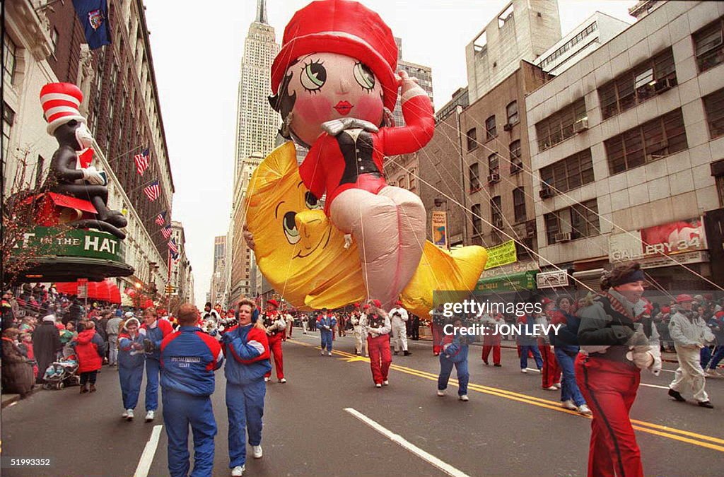 Handlers pull the Betty Boop balloon past Macy's d