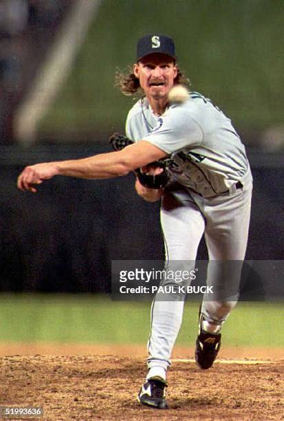 This file photo dated 28 September 1995 shows Seattle Mariners pitcher Randy Johnson pitching against the Texas Rangers in Arlington, Texas. Johnson...