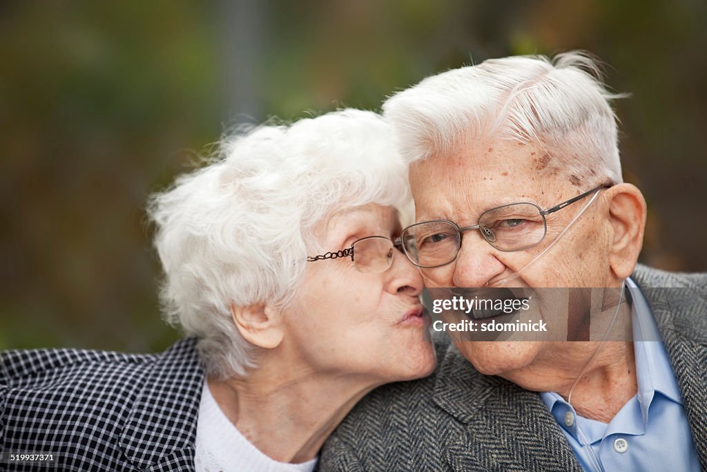 Senior Woman Kissing Her Husband