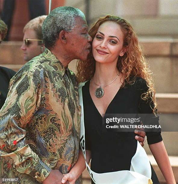 South African President Nelson Mandela hugs Miss Israel Miri Bohadana during a photo-call with 86 Miss World pageant candidates in Pretoria 07...