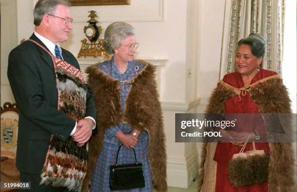 New Zealand Prime Minister Jim Bolger and Queen Elizabeth II , wearing a traditional Maori cloak of Kiwi feathers chat with Maori Queen Te Arikinui...