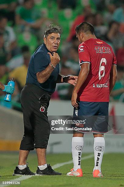 Carlos Reinoso coach of Veracruz gives instructions to Luis Martinez during the 13th round match between Santos Laguna and Veracruz as part of the...