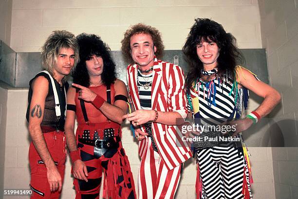 Backstage portrait of American Rock band Quiet Riot at the UIC Pavillion, Chicago, Illinois, November 10, 1984. Pictured are, from left, Carlos...