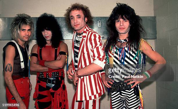 Backstage portrait of American Rock band Quiet Riot at the UIC Pavillion, Chicago, Illinois, November 10, 1984. Pictured are, from left, Carlos...