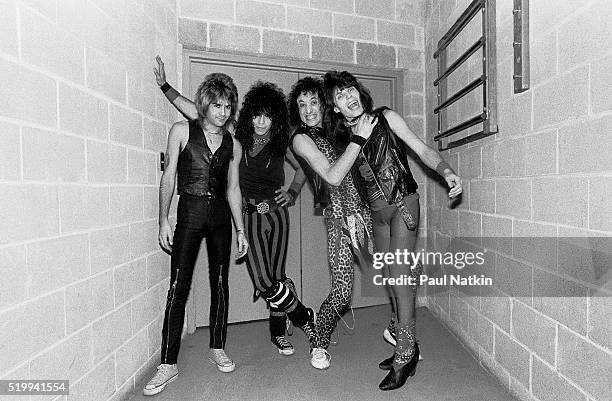 Backstage portrait of American Rock band Quiet Riot at the UIC Pavillion, Chicago, Illinois, November 17, 1983. Pictured are, from left, Carlos...