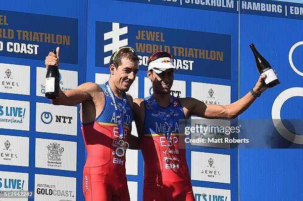 Mario Mola and Fernando Alarza of Spain celebrate on the podium during the ITU World Triathlon Series on April 9, 2016 in Gold Coast, Australia.