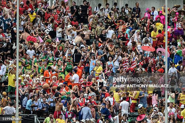 Spectators watch from the South Stand on the second day of the Hong Kong Rugby Sevens tournament on April 9, 2016. / AFP / ANTHONY WALLACE