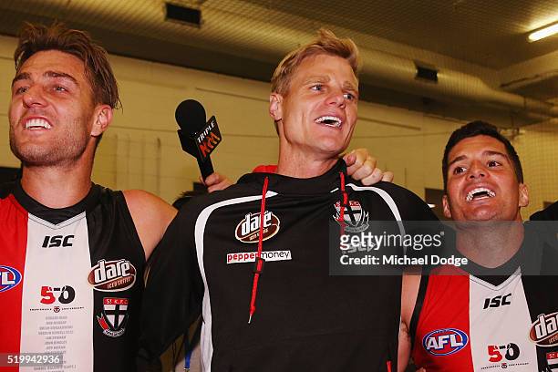 Sam Fisher Nick Riewoldt and Leigh Montagna of the Saints sing the club song after winning during the round three AFL match between the St Kilda...