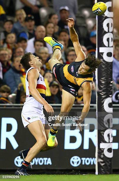 Sam Lloyd of the Richmond Tigers attempts to take a spectacular mark over Jake Lever of the Adelaide Crows during the round three AFL match between...