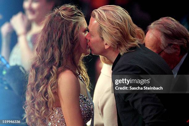 Victoria Swarovski kisses her fiance Werner Muerz during the 4th show of the television competition 'Let's Dance' at Coloneum on April 8, 2016 in...