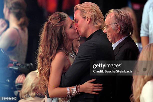 Victoria Swarovski kisses her fiance Werner Muerz during the 4th show of the television competition 'Let's Dance' at Coloneum on April 8, 2016 in...