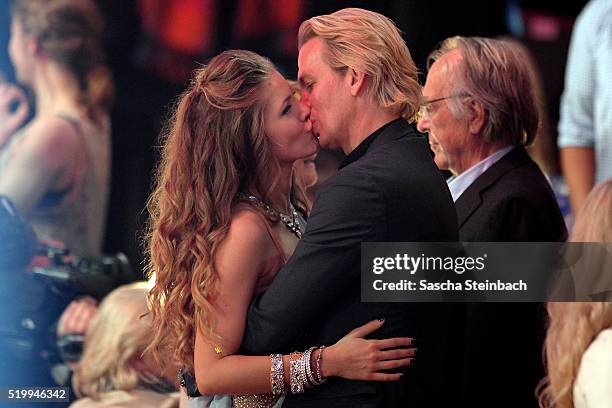 Victoria Swarovski kisses her fiance Werner Muerz during the 4th show of the television competition 'Let's Dance' at Coloneum on April 8, 2016 in...