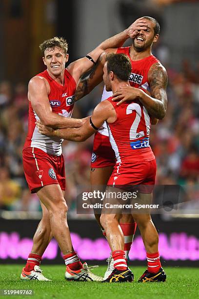 Lance Franklin of the Swans celebrates kicking a goal with team mates Luke Parker and Ben McGlynn of the Swans during the round three AFL match...