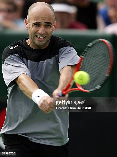 Andre Agassi of the United States in action against Tim Henman of England during day four of the 2005 Kooyong Classic at Kooyong Lawn Tennis Club...