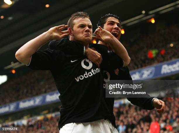 Wayne Rooney and team mate Cristiano Ronaldo of Manchester United respond to Liverpool fans after Rooney scored during the Barclays Premiership match...
