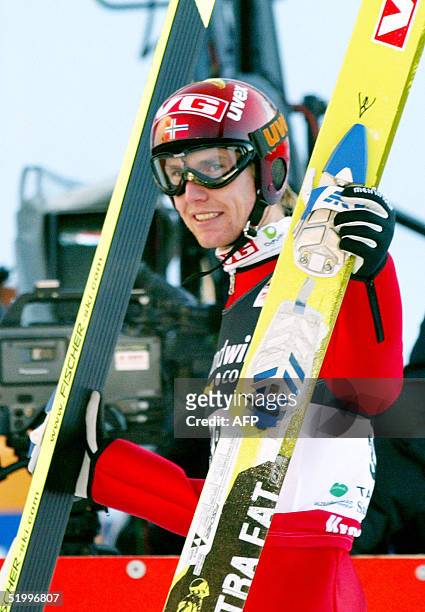 Norway's Roar Ljoekelsoey celebrates after coming second in the Ski Jump World Cup event in Bad Mittendorf/Kulm, 15 January 2005. Austria's Andreas...
