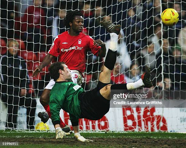 Matt Lawrence of Millwall jumps for the ball with David Johnson of Forest during the Coca-Cola Championship match between Nottingham Forest and...