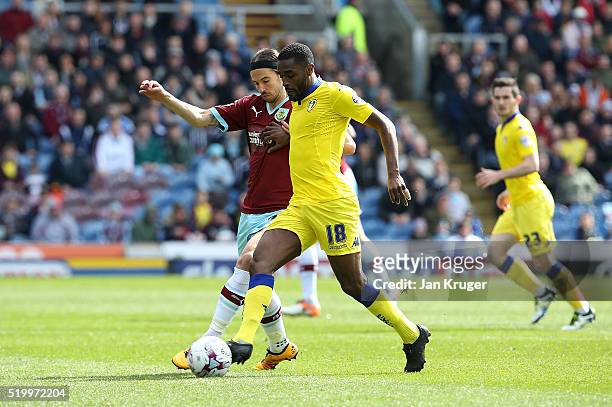 Mustapha Carayol of Leeds battles with George Boyd of Burnley during the Sky Bet Championship match between Burnley and Leeds United at Turf Moor on...