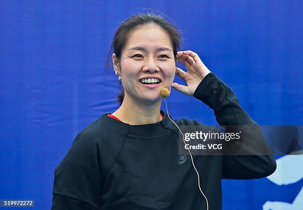 Retired Chinese tennis player Li Na plays tennis with children during the 2016 ITF Junior Masters on April 9, 2016 in Chengdu, China.