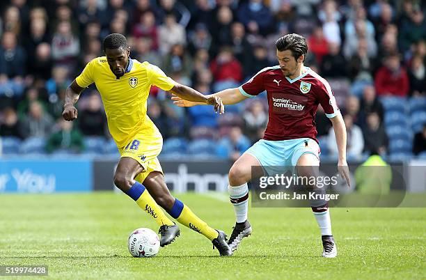 Joey Barton of Burnley competes for the ball with Mustapha Carayol of Leeds during the Sky Bet Championship match between Burnley and Leeds United at...