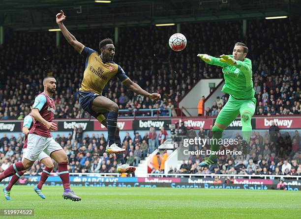 Danny Welbeck of Arsenal trys to lob Adrian of West Ham looks on during the Barclays Premier League match between West Ham United and Arsenal at The...