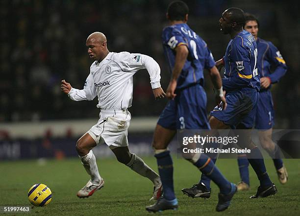 El Hadji Diouf of Bolton takes on Sol Campbell and Ashley Cole during the Barclays Premiership match between Bolton Wanderers and Arsenal at the...