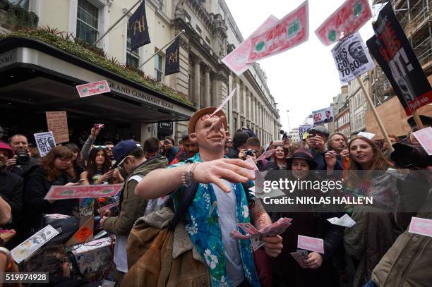 Protesters demonstrate against British Prime Minister David Cameron outside the Conservative Party's Spring Forum in central London following...