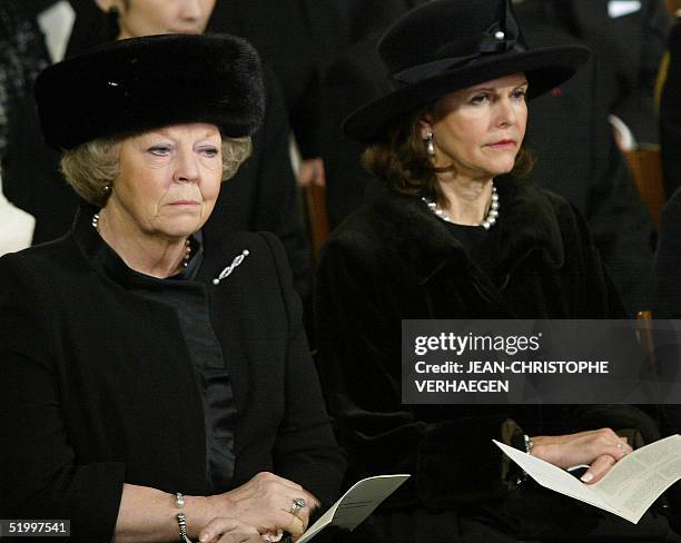 Queen Beatrix of the Netherlands (L and Queen Silvia of Sweden listen to a sermon during the funeral of Luxembourg Grand Duchess Josephine-Charlotte...