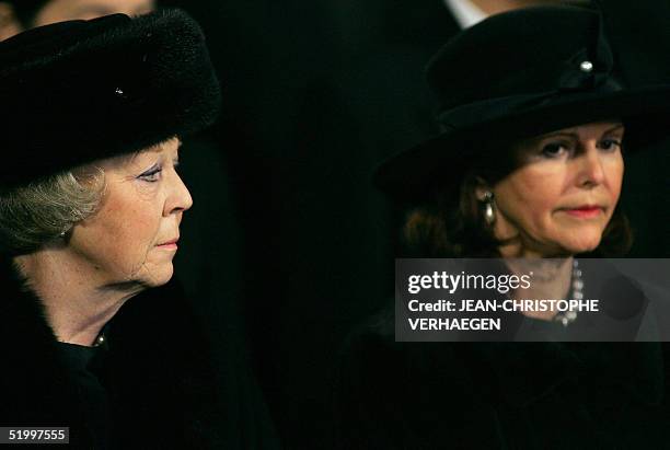 Queen Beatrix of the Netherlands and Queen Silvia of Sweden listen to a sermon during the funeral of Luxembourg Grand Duchess Josephine-Charlotte at...