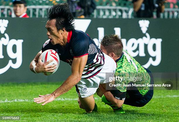 Yiu Kam Shing of Hong Kong is tackled during the 2016 Hong Kong Sevens match between Spain and Hong Kong at Hong Kong Stadium on April 9, 2016 in...