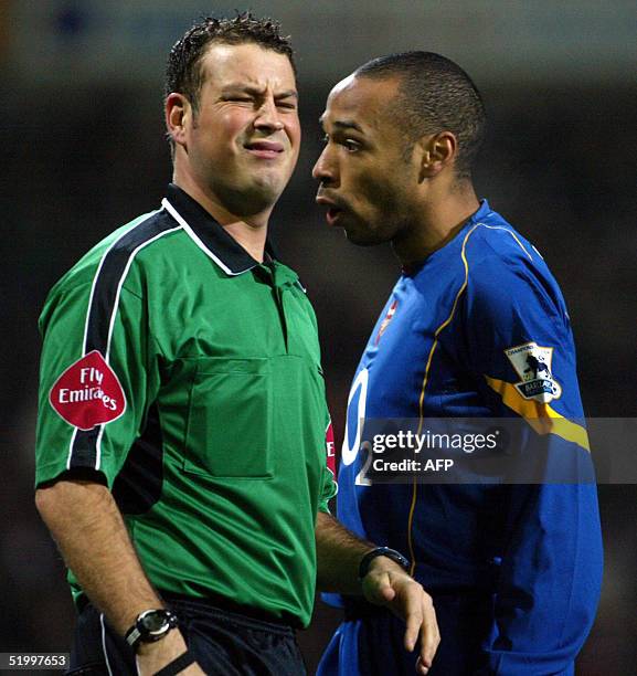 Arsenal's Thierry Henry has a word with referee Mark Clattenburg during their premiership match against Bolton Wanderers at the Reebok Stadium in...