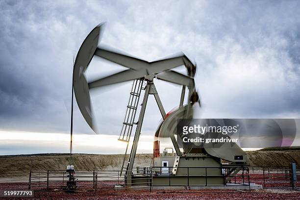 fracking oil well motion blur - shale stock pictures, royalty-free photos & images