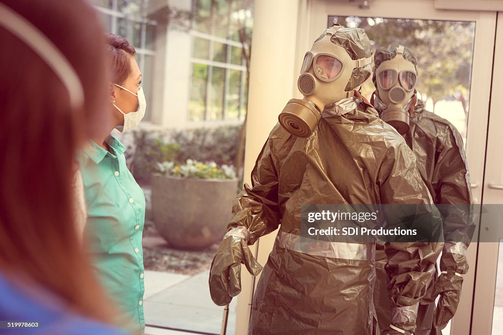 People in hazmat suits entering office for contagious outbreak