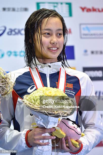 Runa Imai poses for pgotographs on the podium after the Women's 200m Breaststroke final during the Japan Swim 2016 at Tokyo Tatsumi International...